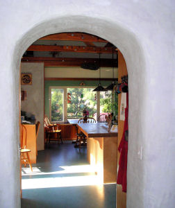 Arched entrance between living room & kitchen dining room