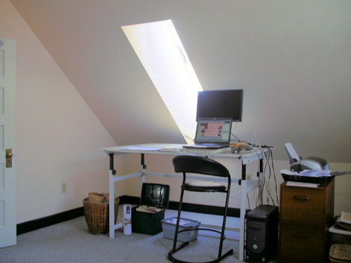 One side of the guest bedroom used as office